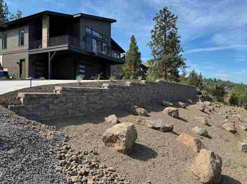 house with rock and retaing wall