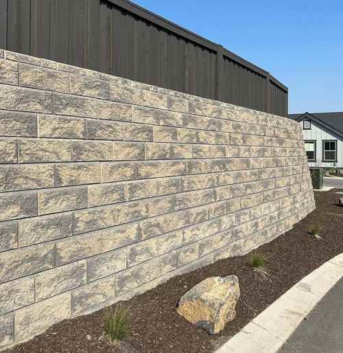 Retaining wall with wood fencing