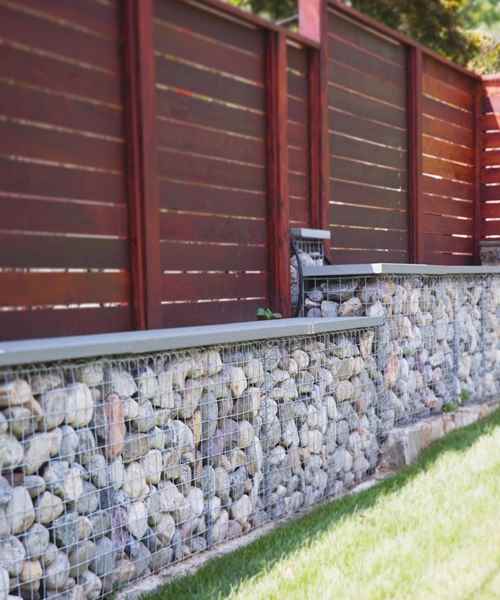 Gabion basket retaining wall with lawn